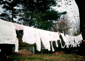 Drying laundry outside takes more time, can't be done any ol' day, and leaves heavy clothes a little dampish.