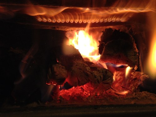 Our wood stove has gasification clean-burning technology. The jets of flame at the top of the image is where secondary air is introduced into the combustion chamber. The secondary air, which is preheated by traveling around the firebox before shooting out the little holes, ignites the particulates and gases in the wood smoke. We get the extra heat from the secondary combustion and the stuff that comes out the top of the chimney is cleaner because the icky stuff has been burned off.