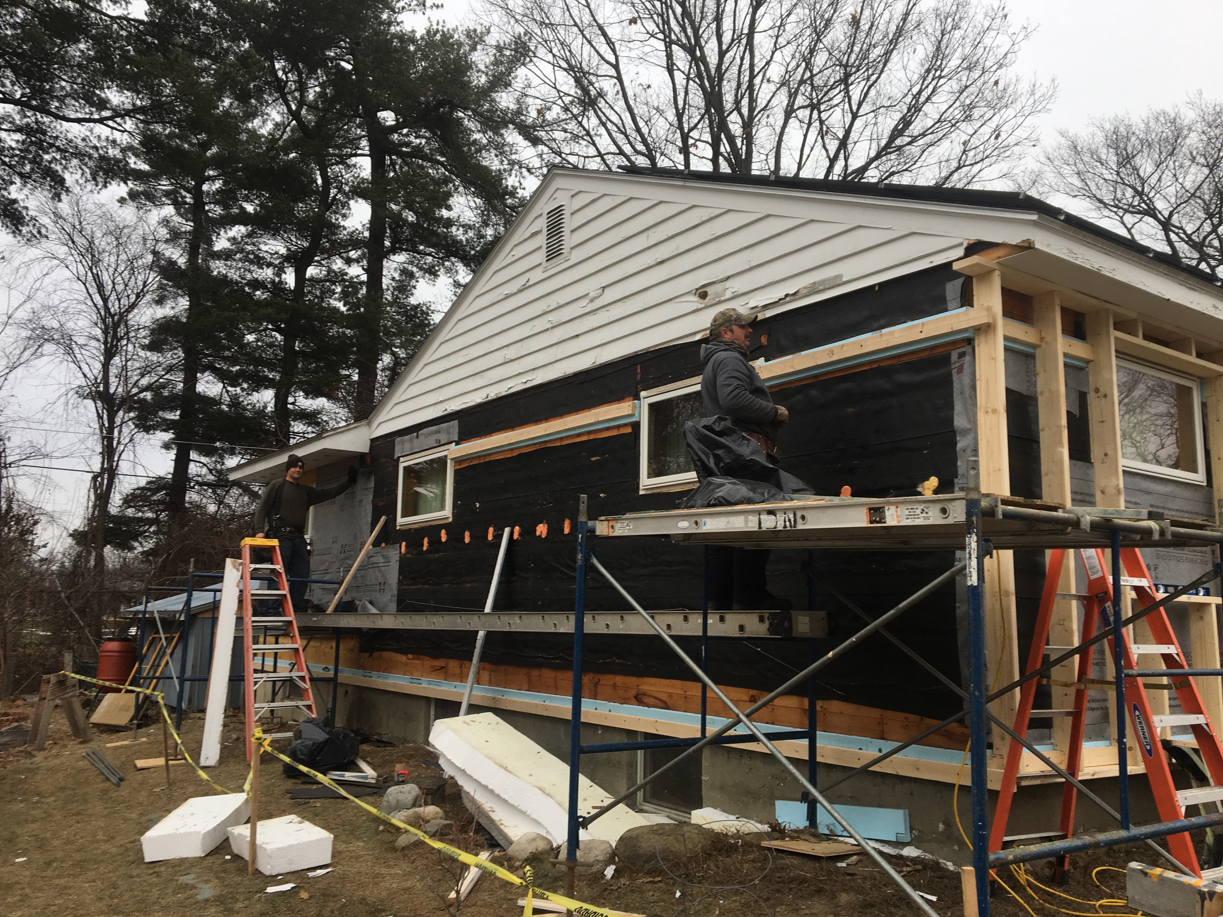 After the siding is removed ledgers are mounted to wall with 1.5